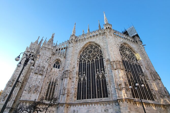 Cathedral & Skyline: Duomo di Milano Tour with Rooftop Access - Inside Duomo di Milano: stained glass, marble, sundial, and Saint Bartholomew