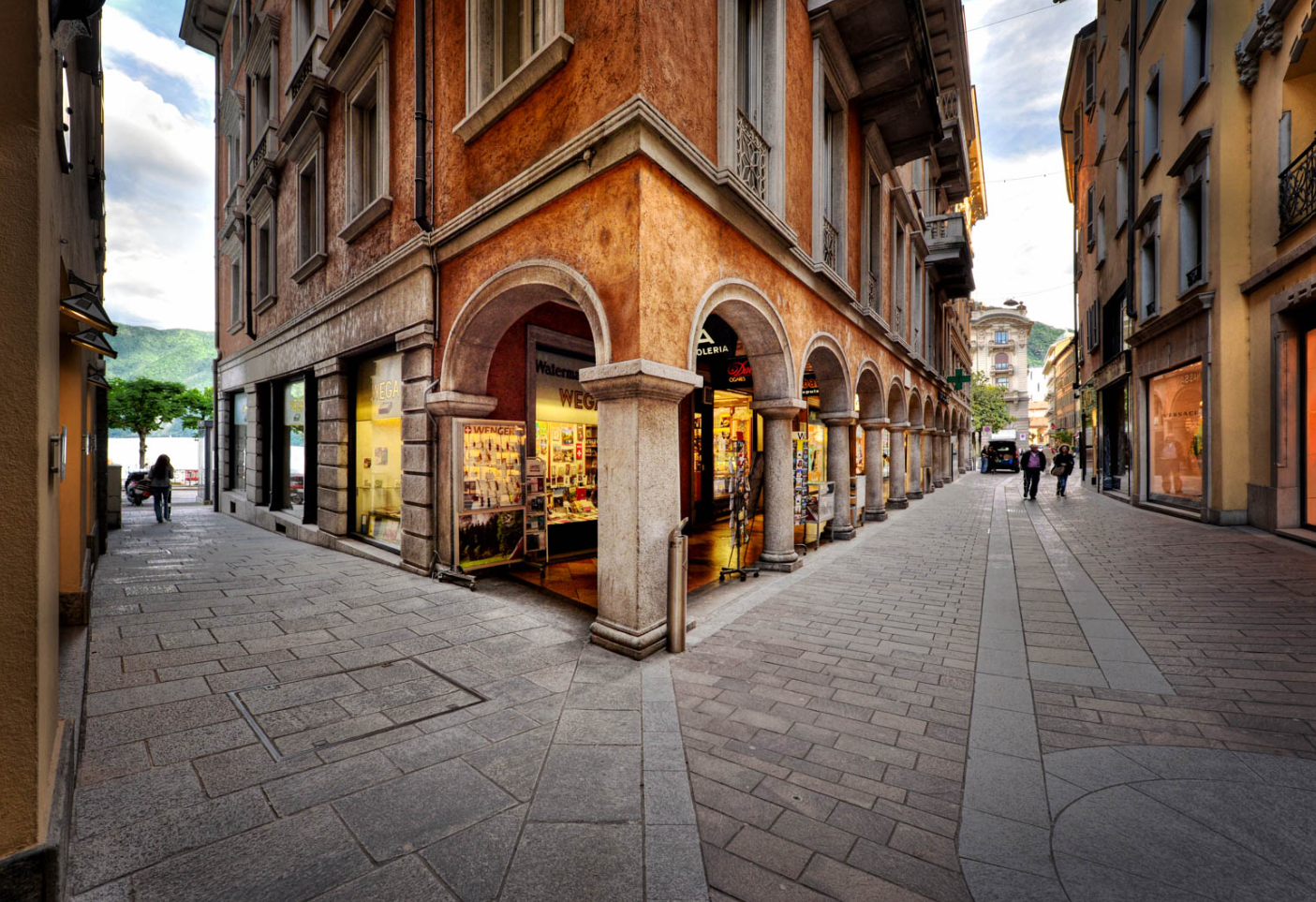 From Milan: Como, Bellagio, and Lugano Exclusive Boat Tour - Lugano, Switzerland: guided stroll, free time, and shop hours to watch