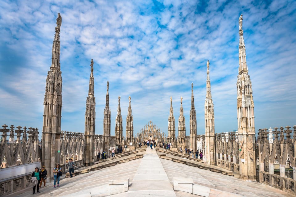 Milan: Cathedral and Terraces Guided Tour with Tickets - Walking pace, meeting point logistics, and dress code reminders