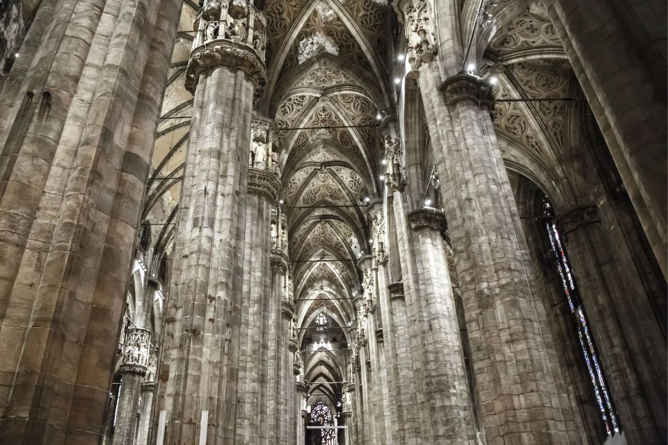 Milan: Duomo Rooftop and Cathedral Guided Tour with Tickets - Duomo Cathedral Interior: Stained Glass, Relics, and the Story of Construction