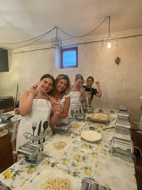 Milan: Pasta and Tiramisu Cooking Class with Wine - Wine and the Group Meal: How the Cooking Turns Into Dinner