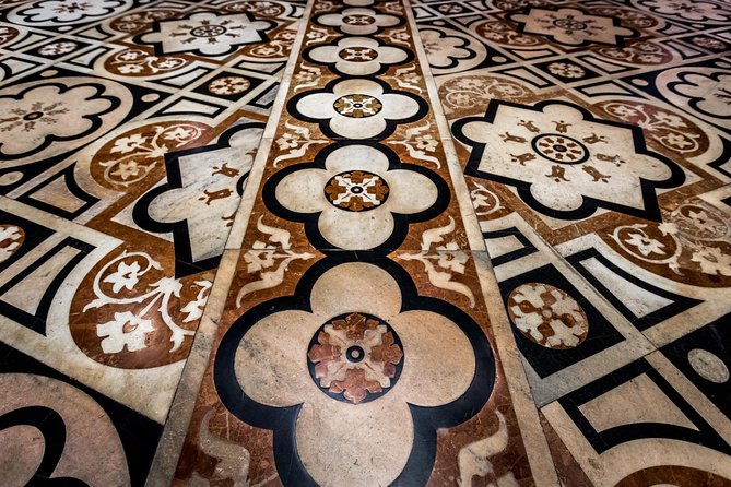 Skip the Line: Milan Duomo Tour - Inside the cathedral: stained-glass light, statues, and the main altar show